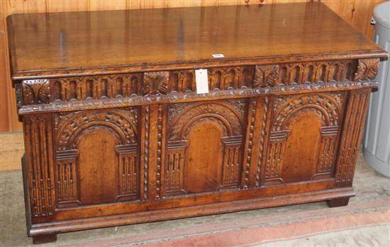 Carved and panelled oak coffer